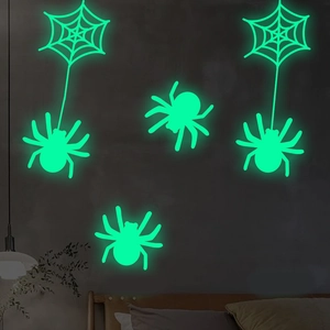 Luminous Halloween wall stickers with spider and web patterns glowing in the dark