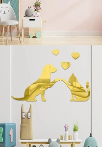 Close-up of golden acrylic mirror wall stickers with dog, cat and heart shapes