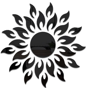 Detail of sunburst mirror wall stickers showing high-gloss black acrylic reflection quality