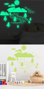 Luminous landscape wall stickers showing day and night glowing effects for kids' rooms