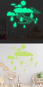 Luminous landscape wall stickers showing day and night glowing effects in a kids room