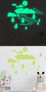 Luminous wall stickers showing glowing forest and mountains in dark and daylight scenes