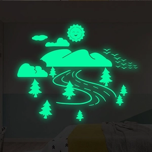 Glow in the dark wall decals featuring luminous mountains and sun for kids room decoration