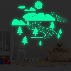 Luminous landscape wall stickers featuring glowing mountains, trees, and birds for nursery