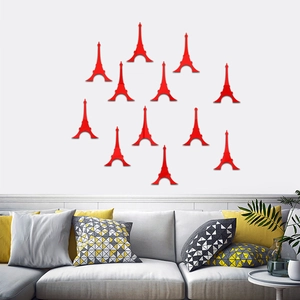 Set of 12 red Eiffel Tower 3D mirror wall stickers displayed on a modern living room wall