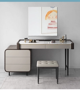 Detail of modern vanity set featuring faux marble tabletop and metal trim accents