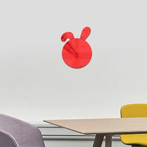 Detailed close-up of a red rabbit acrylic mirror sticker applied on a white wall