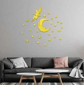 Detail of yellow acrylic mirror wall stickers featuring fairy moon and stars in a living room