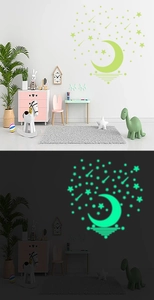 Luminous moon and meteor wall sticker set showing day and night glowing effect in kid's room