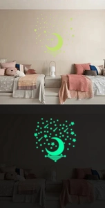 Luminous wall stickers set showing day and night glowing effect in a bedroom