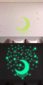 Glow in the dark moon and stars wall stickers set showing day and night fluorescent effect