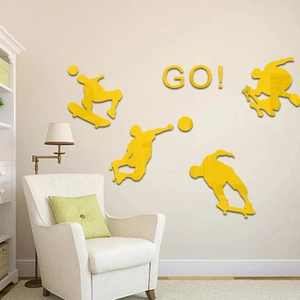 Detailed view of yellow acrylic skateboard silhouettes and GO! mirror wall stickers