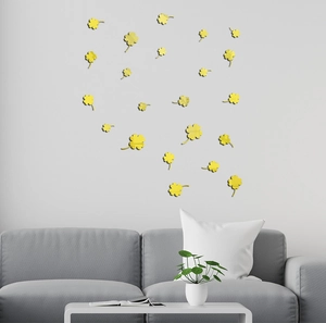 Detail of yellow acrylic clover mirror wall stickers with reflective finish on grey wall