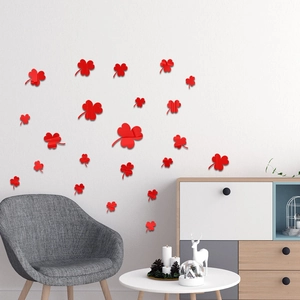 Detail showing red acrylic clover wall stickers on a modern living room wall decor