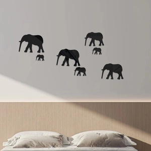 Detail of 7-piece set black acrylic elephant mirror wall stickers in a modern bedroom décor