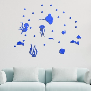 Dettaglio macro di adesivi murali in acrilico blu a tema oceano con pesci e piante