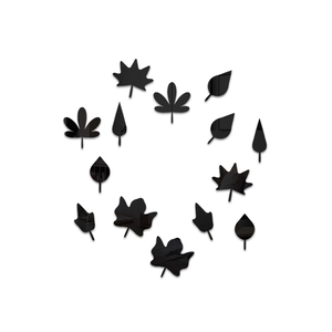 Macro detail of black acrylic mirror leaf wall stickers arranged in a circular pattern