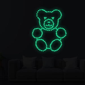 Sticker mural ours en peluche lumineux vert néon composé de petits cœurs décoratifs