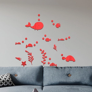 Red acrylic ocean world wall stickers set featuring sea creatures above a blue sofa