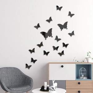 Detailed view of 3D black acrylic mirror butterfly wall stickers in a modern living room
