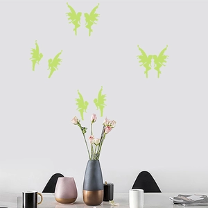 Detailed view of luminous butterfly fairy wall stickers glowing on a white wall