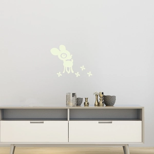 Detail of glow in the dark cartoon deer wall stickers in a minimalist kids room