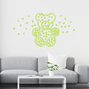 Luminous wall sticker featuring a bear made of green dots in a modern living room