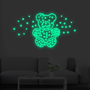 Luminous wall stickers featuring a glowing green teddy bear and dots for home decor