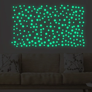 Green glow in the dark dot wall stickers showing luminous effect in dark living room