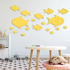 Detail of yellow fish wall decals in different sizes for creative children's room decor