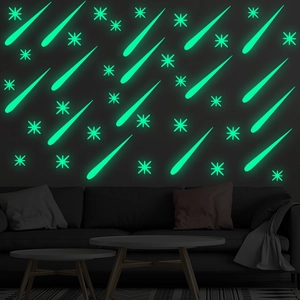 Luminous meteor wall stickers set with glowing stars for bedroom decor in dark green