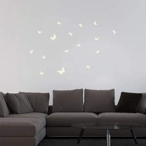 Luminous butterfly wall stickers creating a romantic glow on a modern living room wall