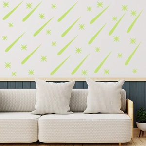Luminous green star and meteor wall stickers displayed on a modern living room sofa wall