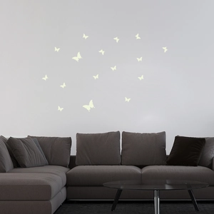 Detailed view of luminous butterfly wall stickers decorating a modern living room wall