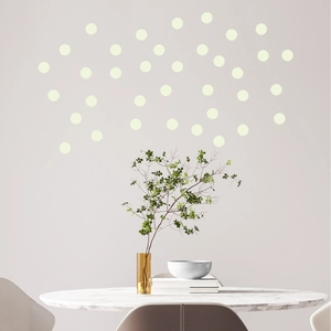 Close-up of geometric luminous dot wall stickers used for minimalist home decor