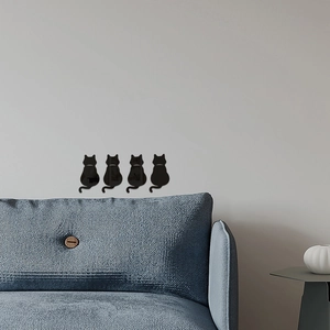 Modern set of four black cat silhouette wall decals in a stylish living room setting