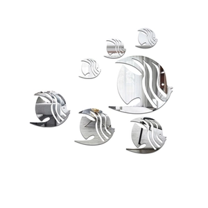 Detail of 7-piece acrylic fish mirror wall stickers with modern hollowed-out design