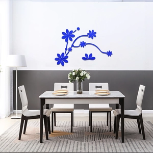 Detail view of 3D blue floral mirror wall stickers with vine pattern on living room wall