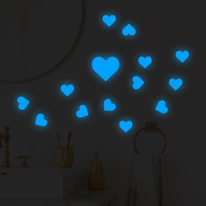 Glow-in-the-dark blue heart wall stickers in various sizes for bedroom decor