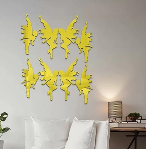 Detail view of 8 piece yellow acrylic fairy wall decals in a modern living room setting