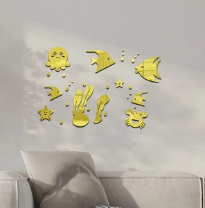 Macro detail of golden mirror acrylic sea life wall stickers in a cozy living room decor