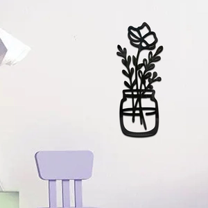 Detail of 3D black acrylic flower wall sticker with modern minimalist floral silhouette