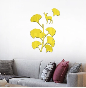 Detailed close-up of 3D acrylic gingko leaf mirror wall stickers with a deer silhouette