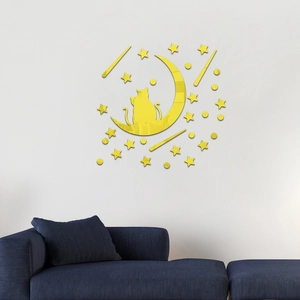Detail of yellow acrylic mirror wall stickers featuring cats and stars on a white wall