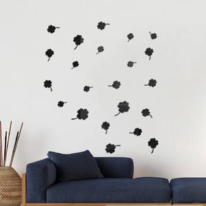 Detailed view of 3D black clover acrylic wall stickers in a modern living room setting