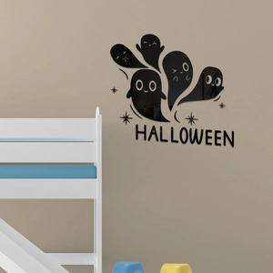 Macro detail of 3D acrylic Halloween mirror wall stickers with ghost patterns and text