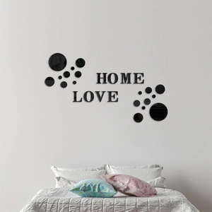 Detail of 3D acrylic mirror wall stickers featuring HOME and LOVE text in black finish