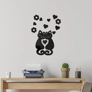 Close-up of black mirror acrylic cat wall stickers with heart and floral accents