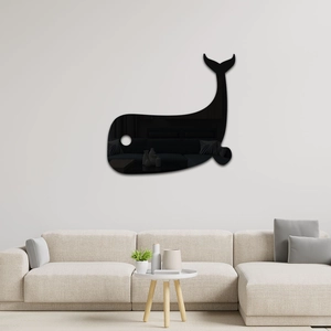 Detail of whale shaped black acrylic mirror wall sticker in a modern living room