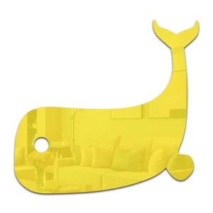 Macro detail of yellow acrylic whale mirror sticker showing home interior reflection
